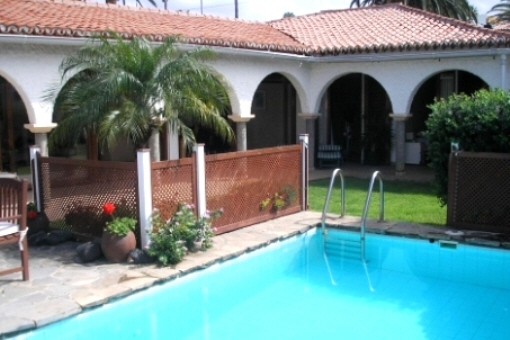 View of the house with garden and pool