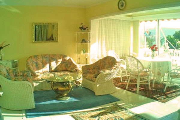 Living-dining area with high windows