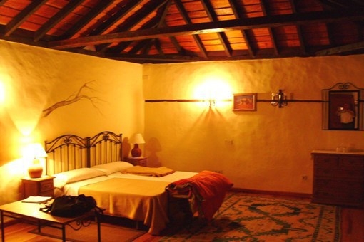 Spacious bedroom with beautiful wood beam ceiling