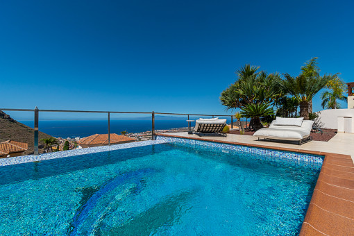 Pool area with sea views