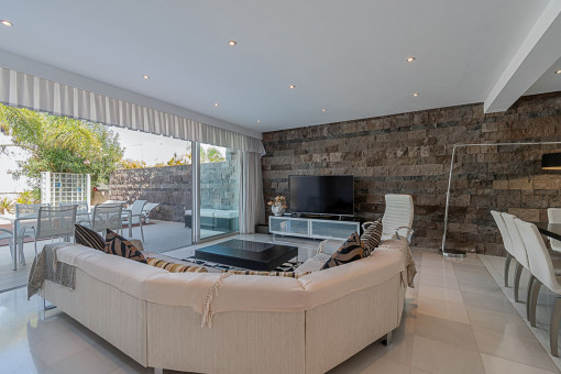 Living and dining area facing to the pool