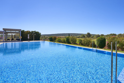 Large communal pool overlooking the golf course