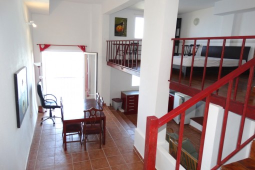 Above the kitchen and the dining area is the bedroom