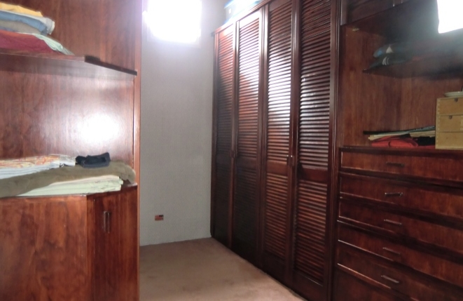 Spacious dressing room with large wardrobes