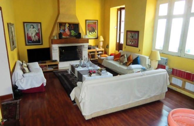 Spacious living area with beautiful fireplace