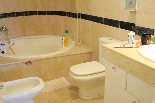 One of the bathrooms with a beautiful round bathtub