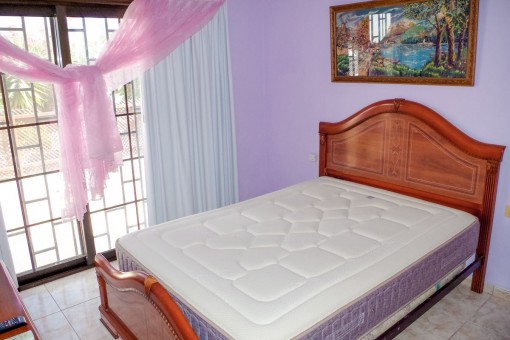 Comfortable bedroom with double bed
